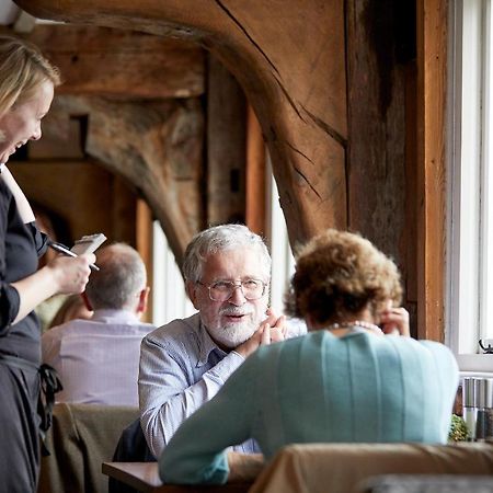 Tuddenham Mill Luxury Hotel Exterior photo A waitress taking an order