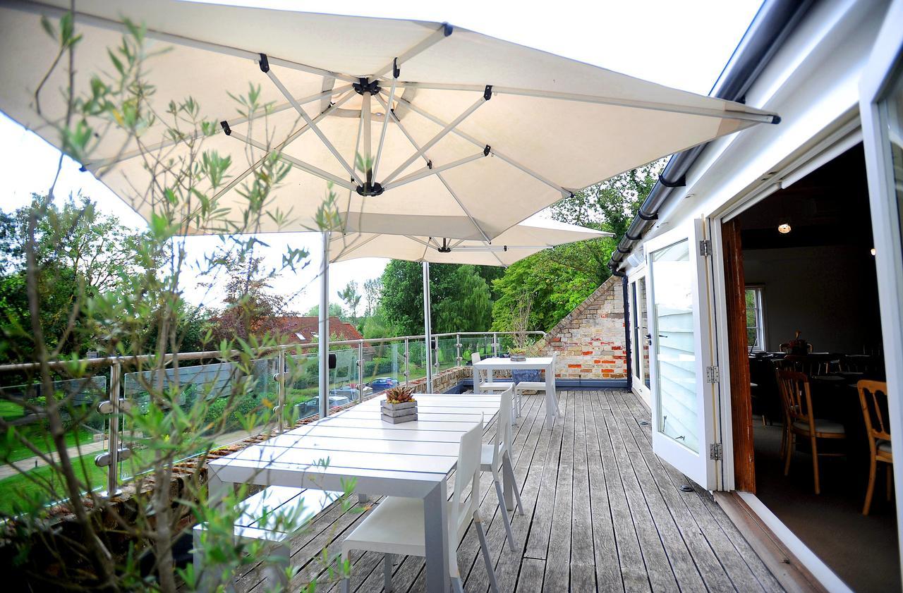 Tuddenham Mill Luxury Hotel Exterior photo A patio umbrella