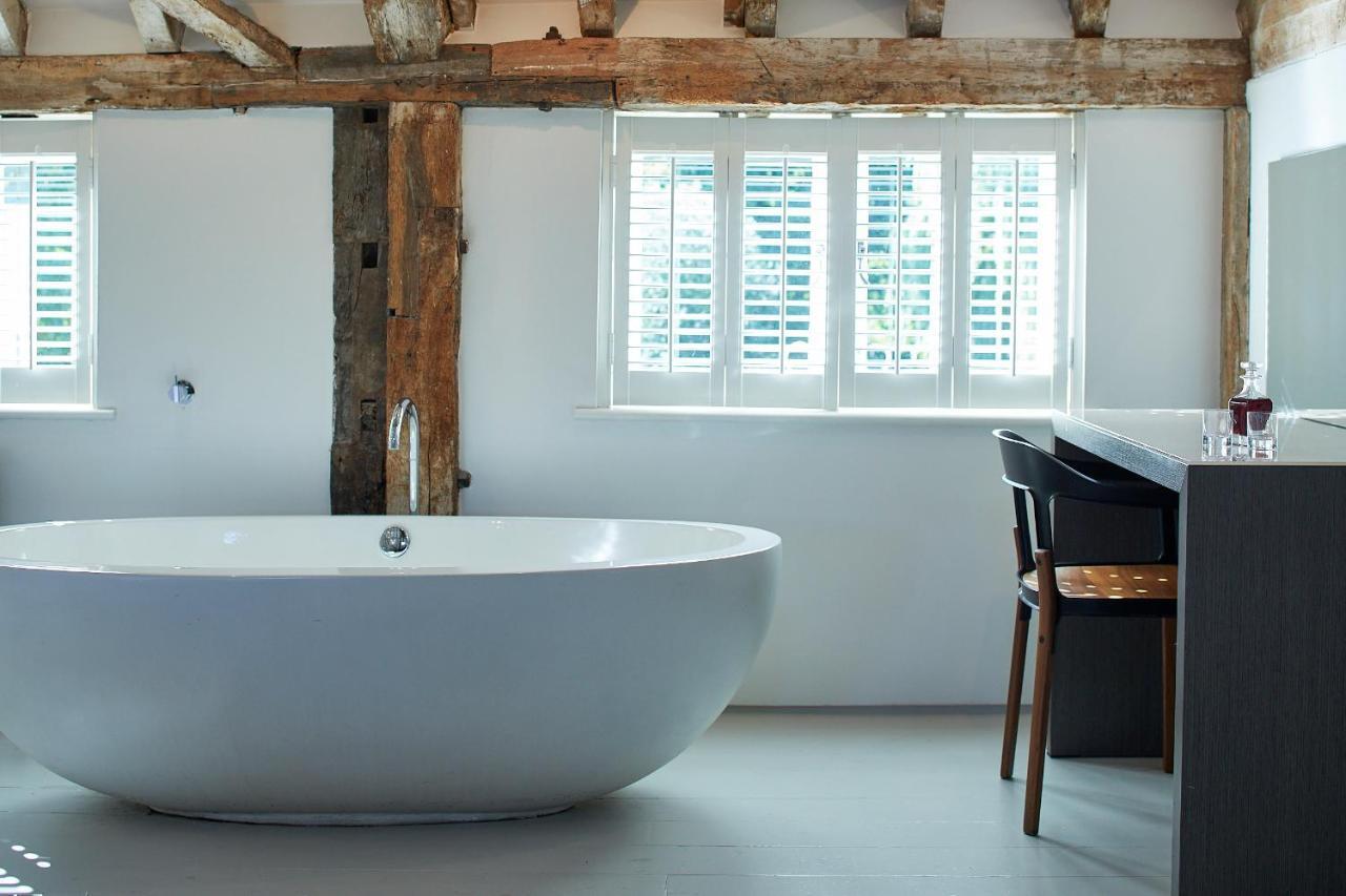 Tuddenham Mill Luxury Hotel Exterior photo Bathroom with shutters